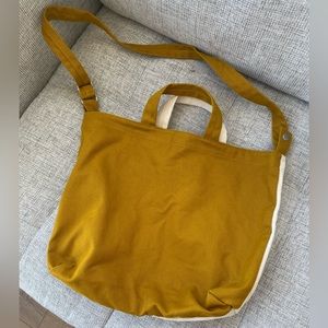 Baggu convertible canvas bag, yellow and white, adjustable shoulder strap